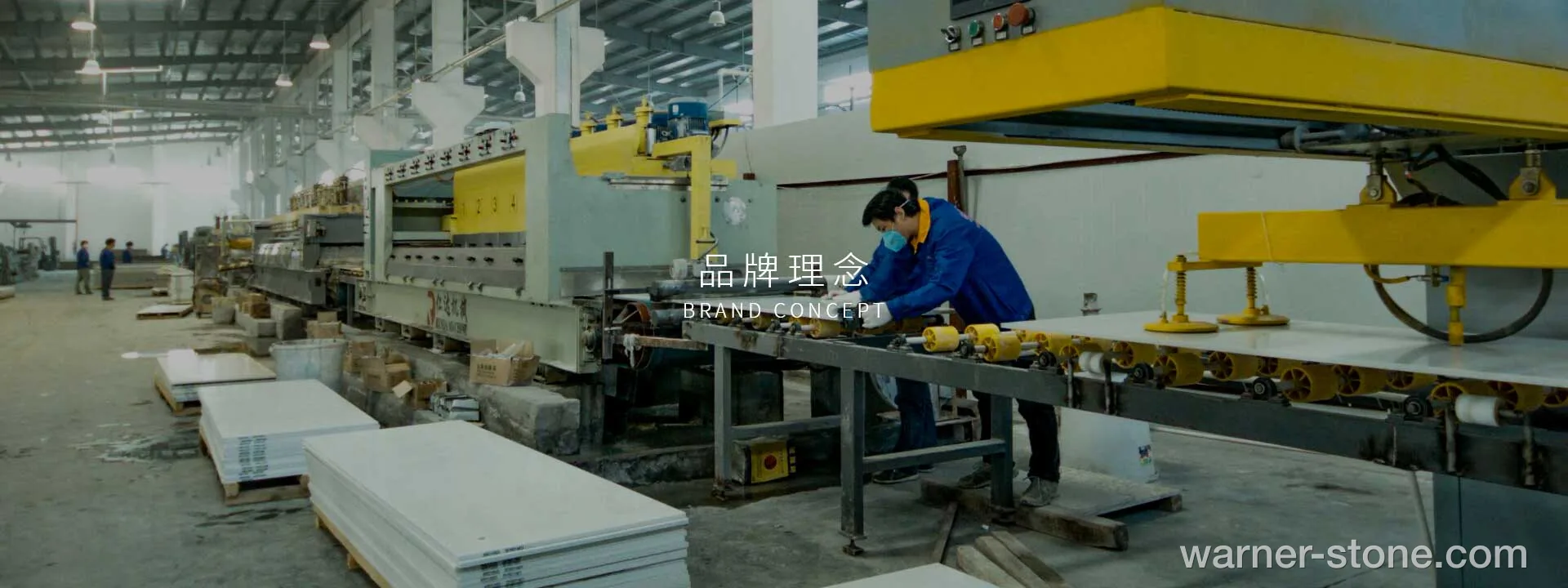 Workers operating automated quartz slab calibration and polishing line