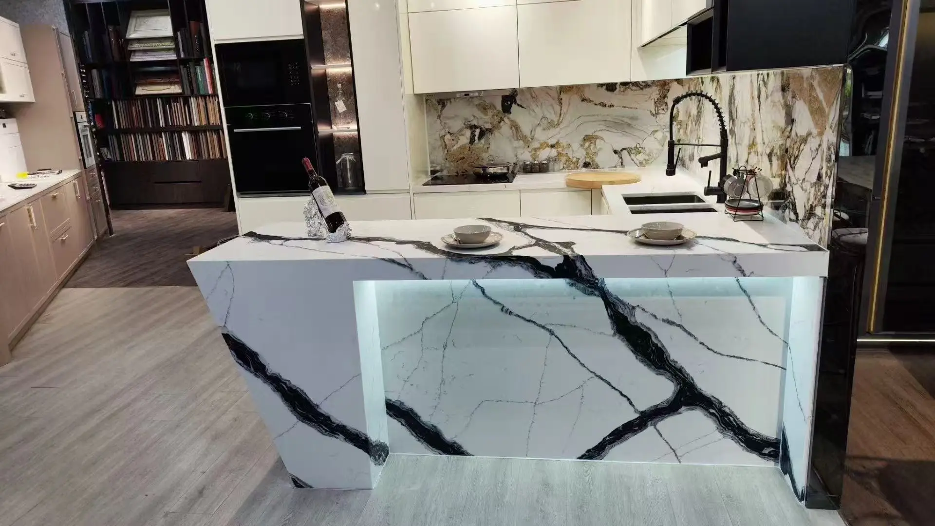 High-end luxury kitchen island featuring mitered edge and integrated ambient lighting