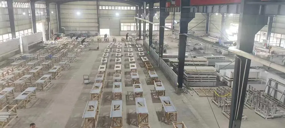 Aerial panoramic view of hundreds of prefabricated vanity and kitchen countertops on sawhorses