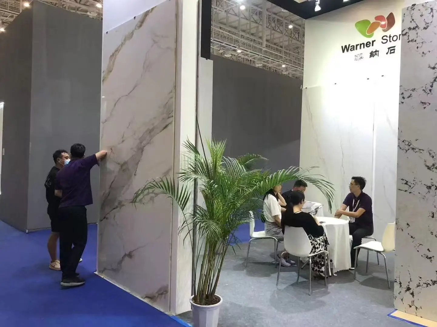 Warner Stone global trade fair booth meeting with international commercial clients