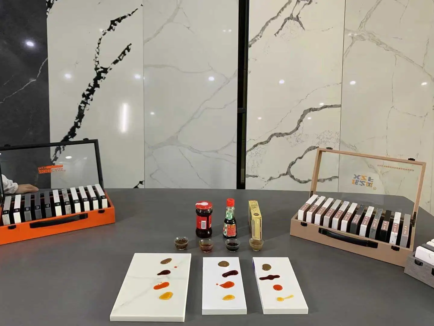 Warner high-density quartz stain resistance testing with presentation sample boxes
