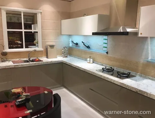 L-shaped kitchen installation featuring bright white crystal quartz surface