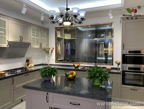 Installed luxury kitchen island with dark crystal quartz and waterfall bevel