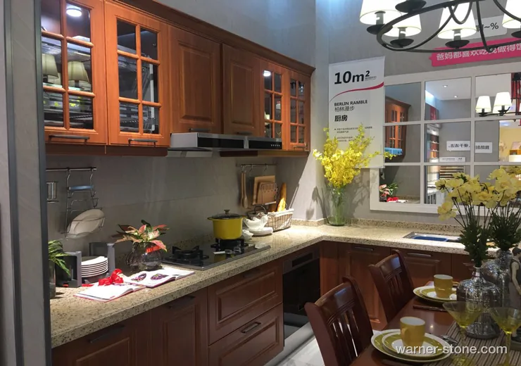 Warm American country kitchen featuring golden crystalline quartz worktops and breakfast bar