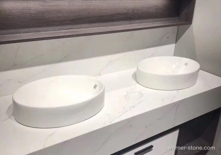 Floating luxury hotel bathroom vanity crafted from Warner Calacatta veined quartz with dual vessel sinks