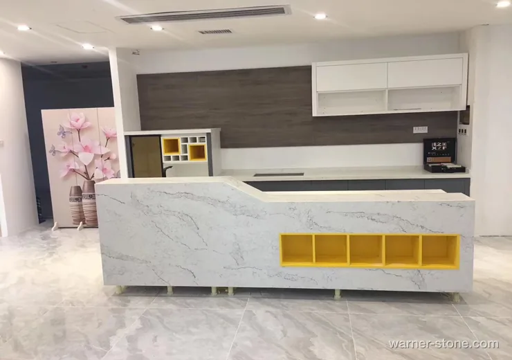 Commercial reception counter featuring Calacatta quartz surface with yellow accent niches
