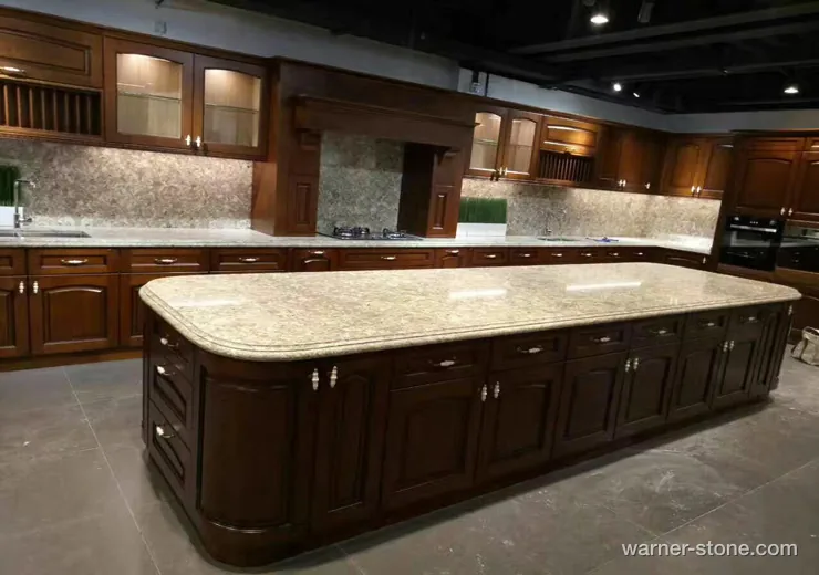 Luxury villa kitchen showcasing extra-large beige quartz island slab with bullnose corner detailing