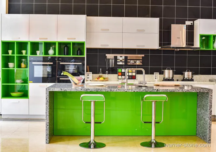 Contemporary two-tone kitchen featuring grey crystalline quartz waterfall island with green cabinetry