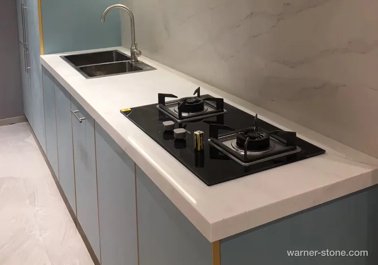 Contemporary kitchen with thick solid white quartz top and precision CNC undermount double sink cutout