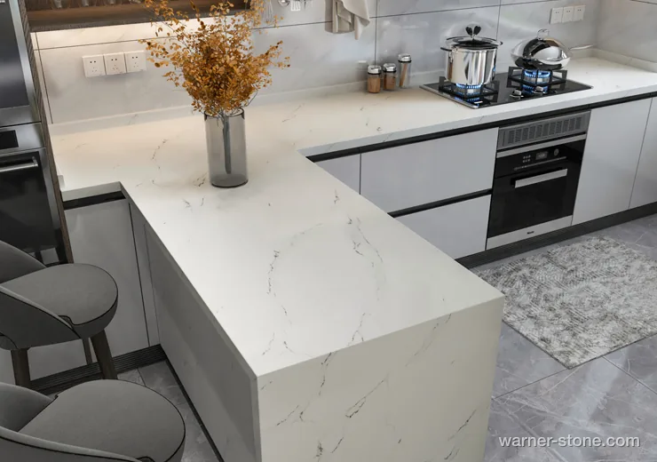 Contemporary kitchen peninsula featuring clean white veined quartz with waterfall edge