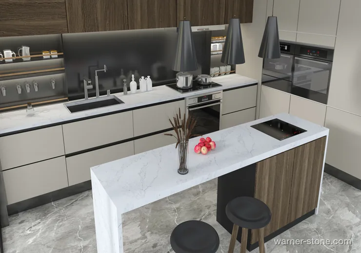 Upscale kitchen featuring double-waterfall island in fine Calacatta quartz